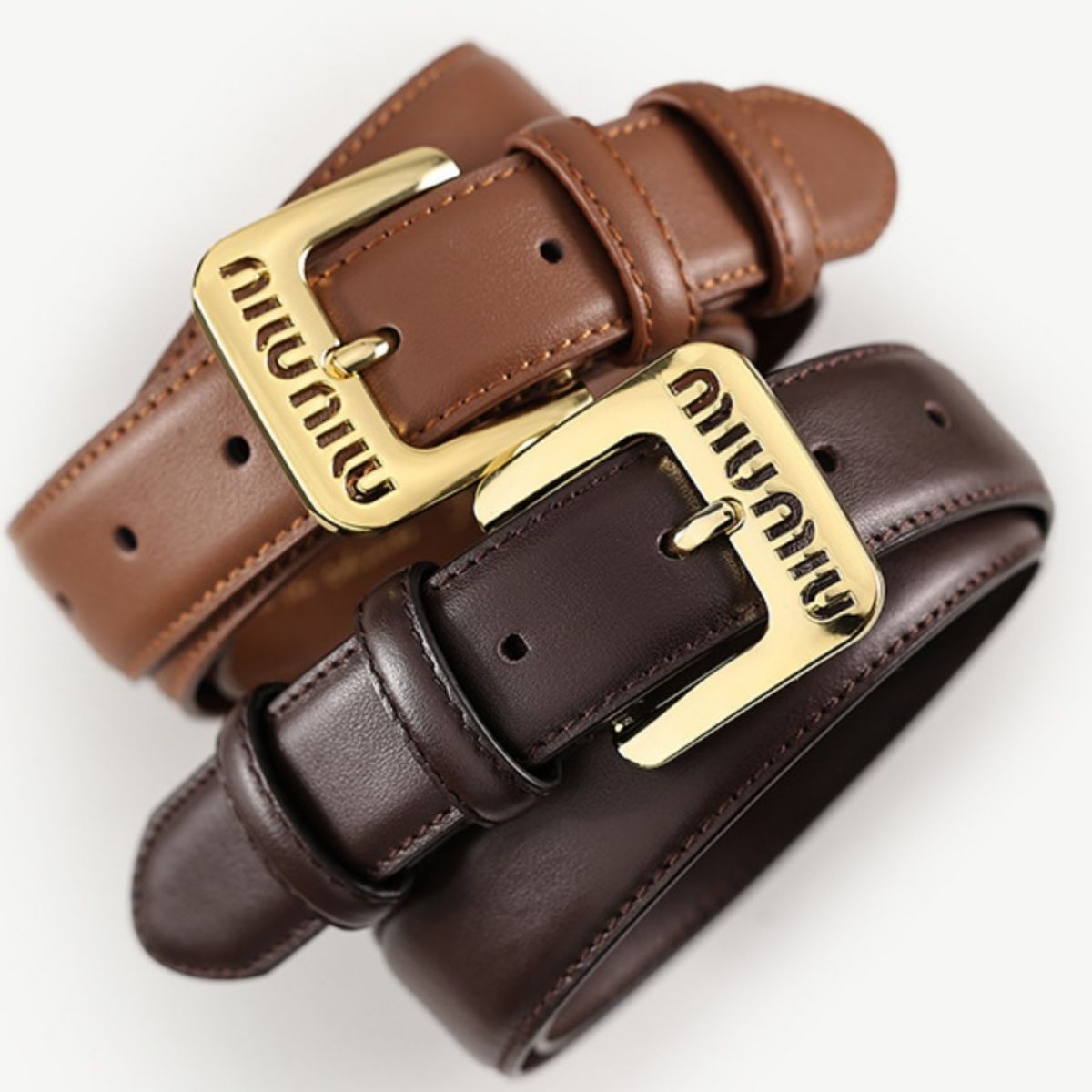 Brown and dark brown cowhide leather belts with gold buckles