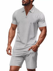 Men's grey textured polo shirt and shorts ensemble with a V-neck and short sleeves.
