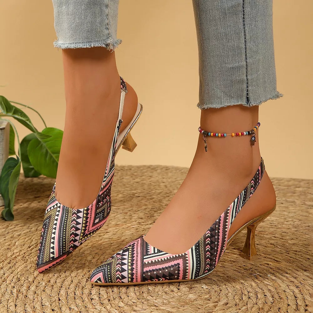 Multicolor geometric patterned slingback kitten heels with pointed toe and kitten heel.