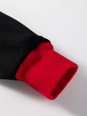 Black sweatshirt with red ribbed cuff detail