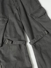 Grey cargo pants with buckle detail, multiple pockets, and distressed accents.