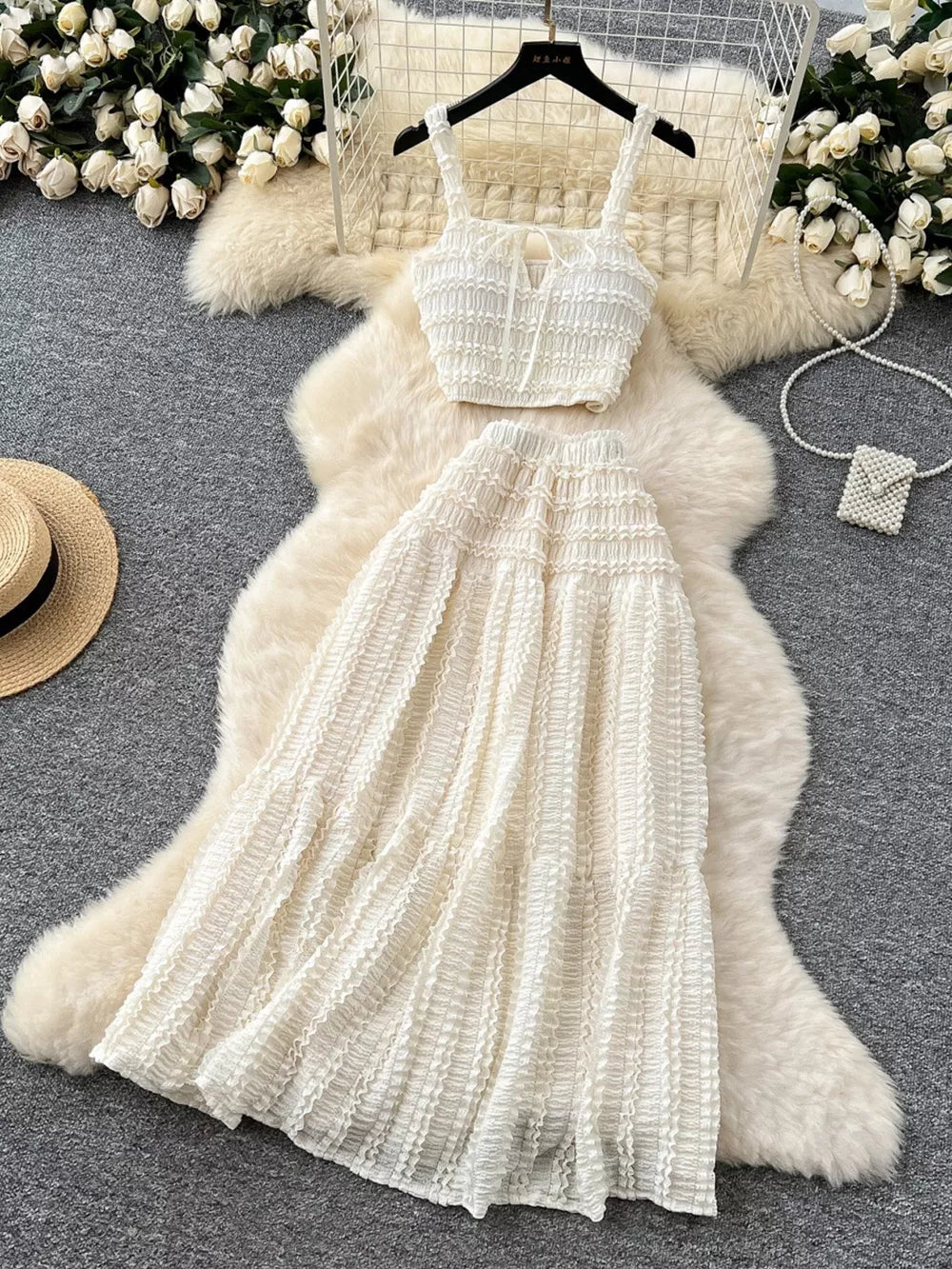 White ruched crop top and maxi skirt set with tie detail and frill hem.
