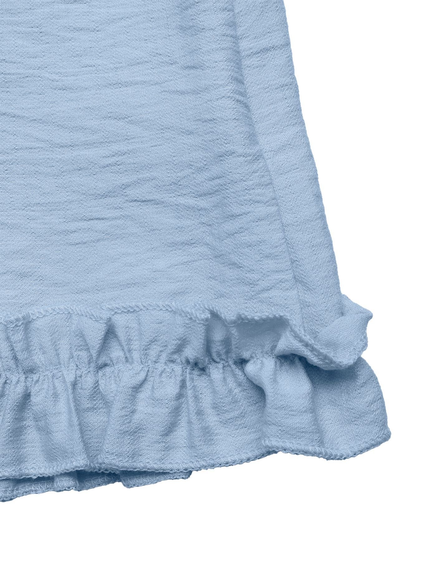 Light blue smocked romper with ruffle hem detail