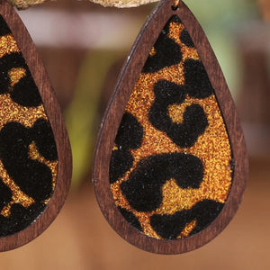 Wood-framed teardrop earrings with leopard print glitter detail