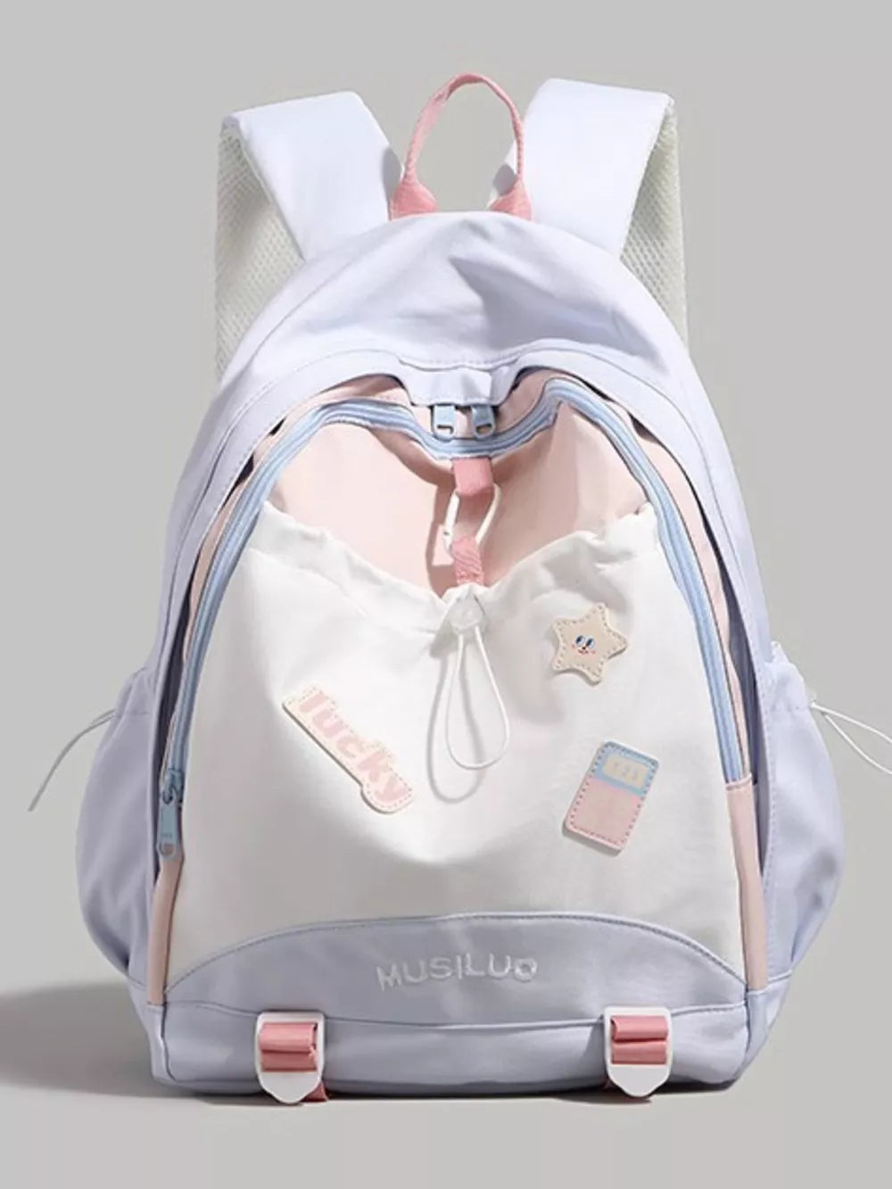Contrasting accent drawstring backpack in white, pink, and light purple with cute patches and buckle details.