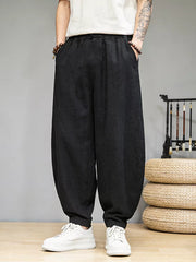 Black relaxed fit sweatpants for men with pockets and a drawstring waist.
