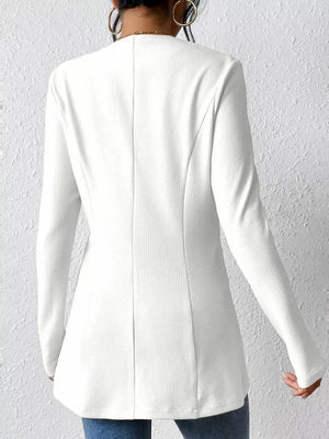 White single-button blazer with tailored fit and textured fabric.