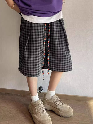 Men's dark gray checkered drawstring shorts with colorful tie detail