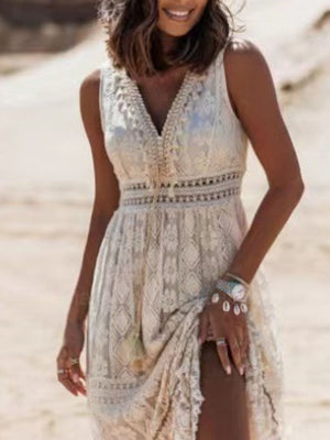 White lace V-neck maxi dress with crochet detail and a high slit.