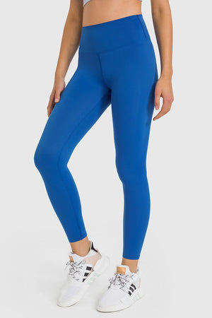 Blue high-waist performance leggings with ankle length and a sculpted fit.