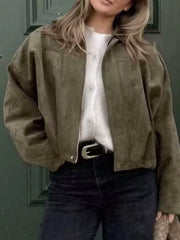 Oversized military green zip-up jacket with a collar, styled with a white shirt and black jeans.