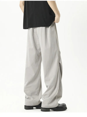 Plus-size grey loose fit drawstring pants with a casual, relaxed cut.