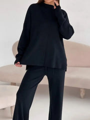 Black relaxed fit knit co-ord set with mock neck top and wide leg pants.