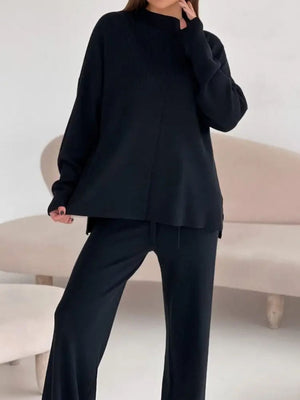 Black relaxed fit knit co-ord set with mock neck top and wide leg pants.