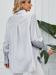 Balloon sleeve stripe shirt with button-up front and smocked cuffs.