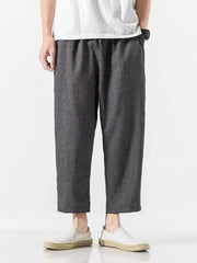 Men's dark gray relaxed fit cropped sweatpants with elastic waistband.