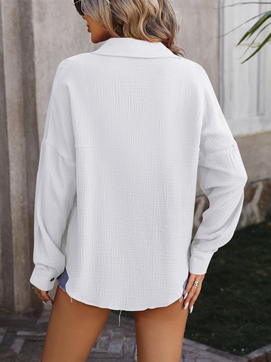 White textured cotton overshirt with relaxed silhouette and button cuff.