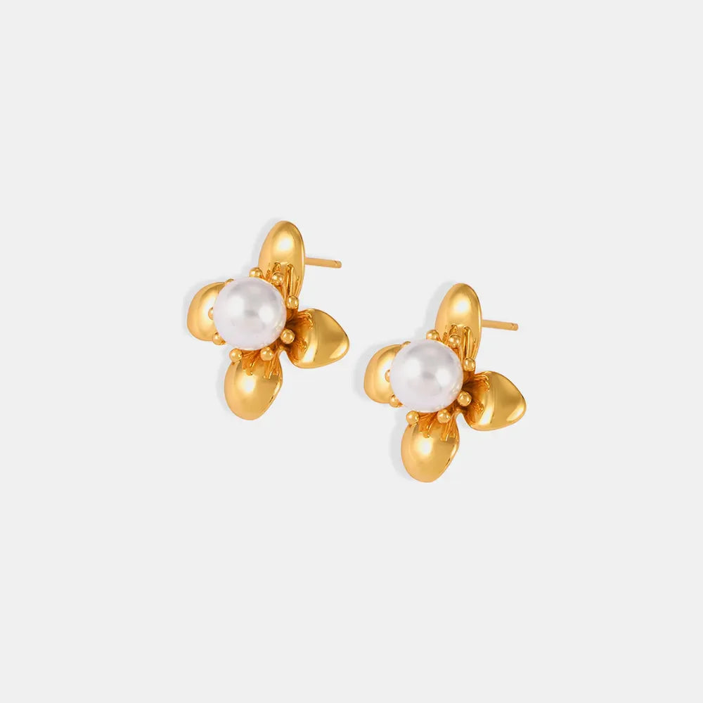 Gold petal pearl stud earrings with a flower design.