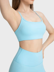 Strappy back active crop top in pastel blue with a square neckline.