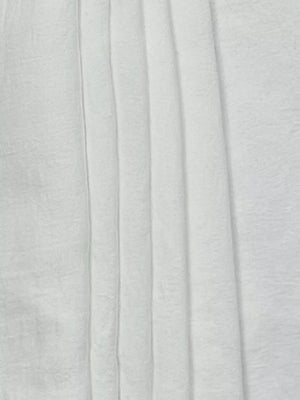 White relaxed wide-leg maternity pants with vertical pleats and drawstring detail.