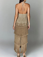 Camel halter neck maxi dress with tiered fringe detail and open back.