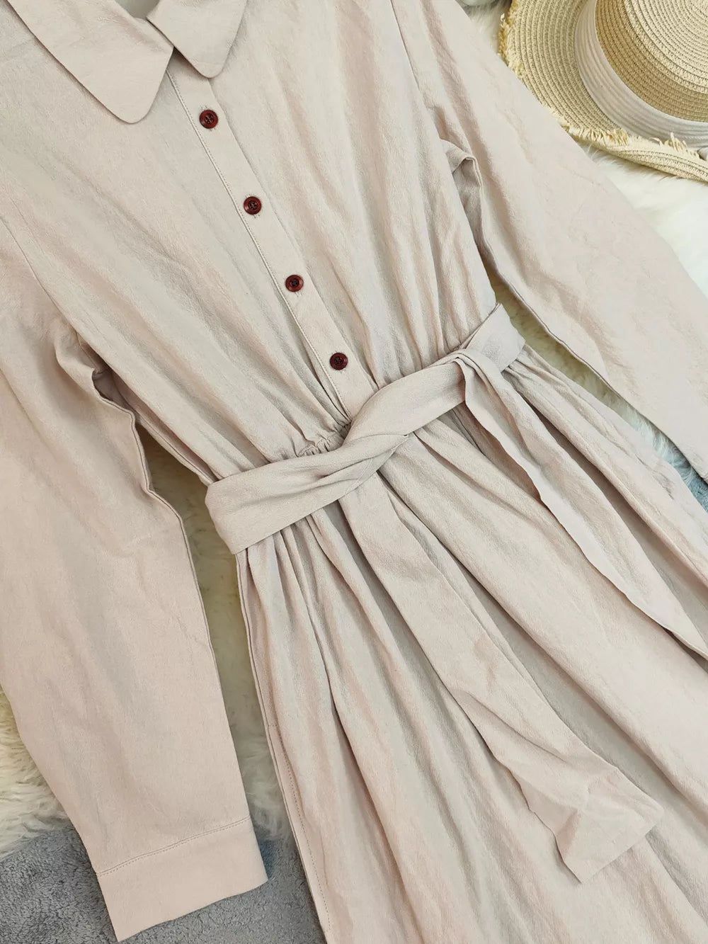 Belted maternity maxi dress in khaki with button front and ruffled hem detail.