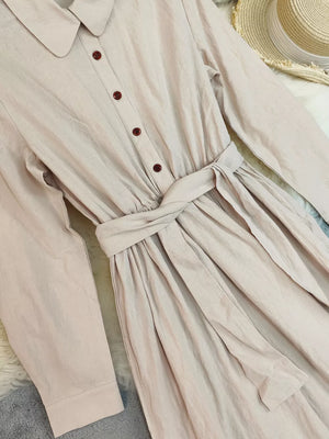 Belted maternity maxi dress in khaki with button front and ruffled hem detail.