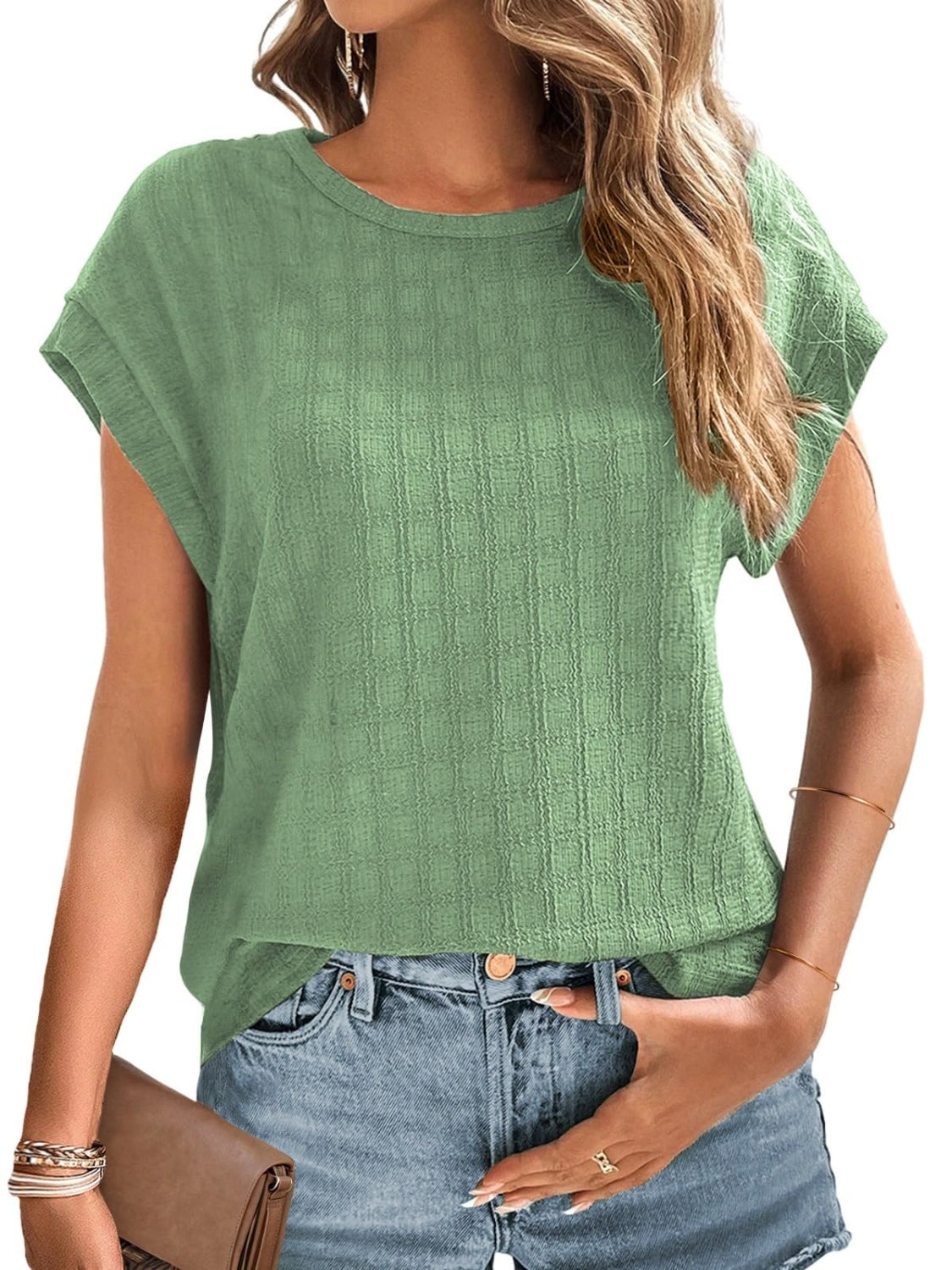 Sage green woven texture cap-sleeve blouse with a crew neck.