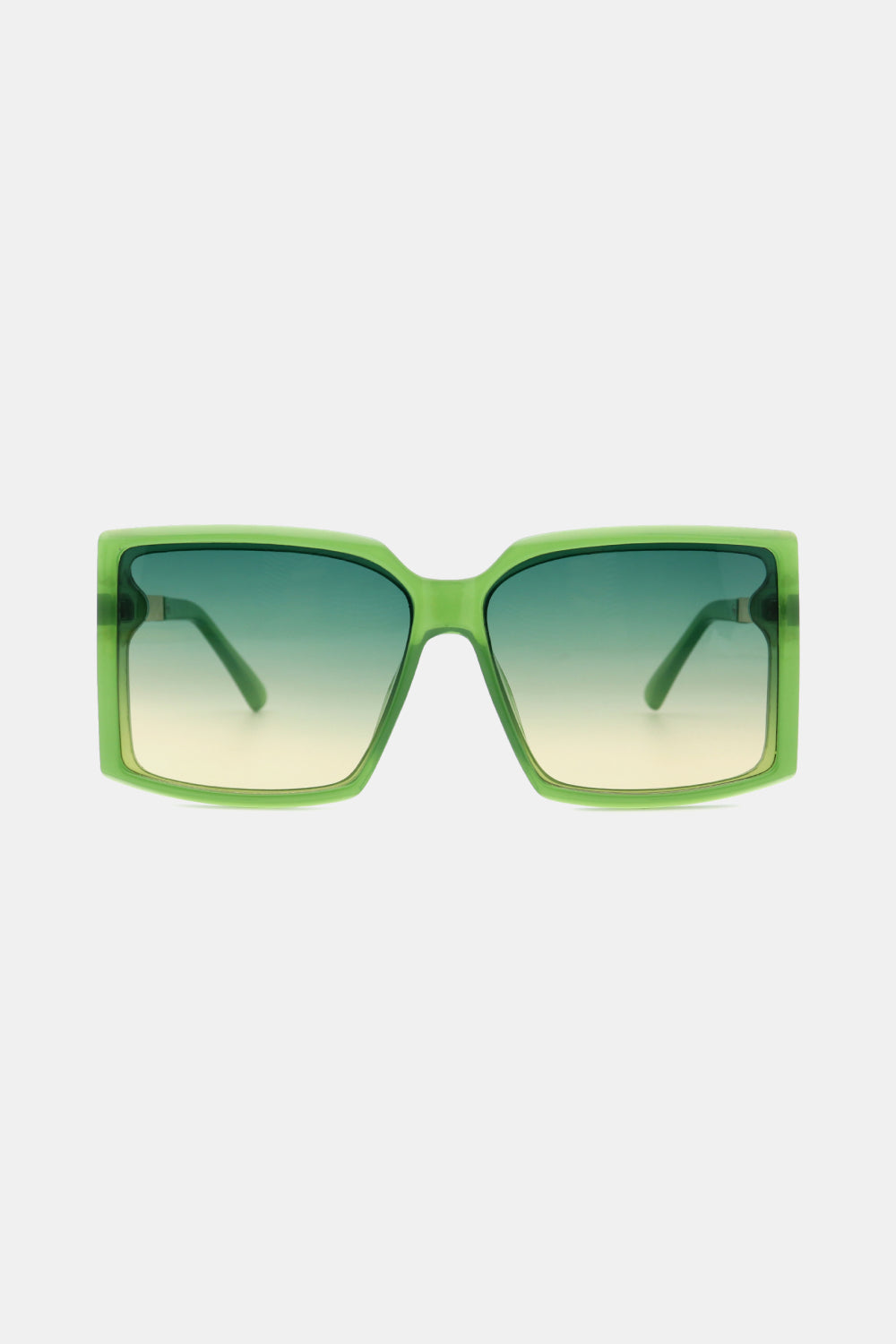 Green geometric sunglasses with gradient lenses and bold frames.