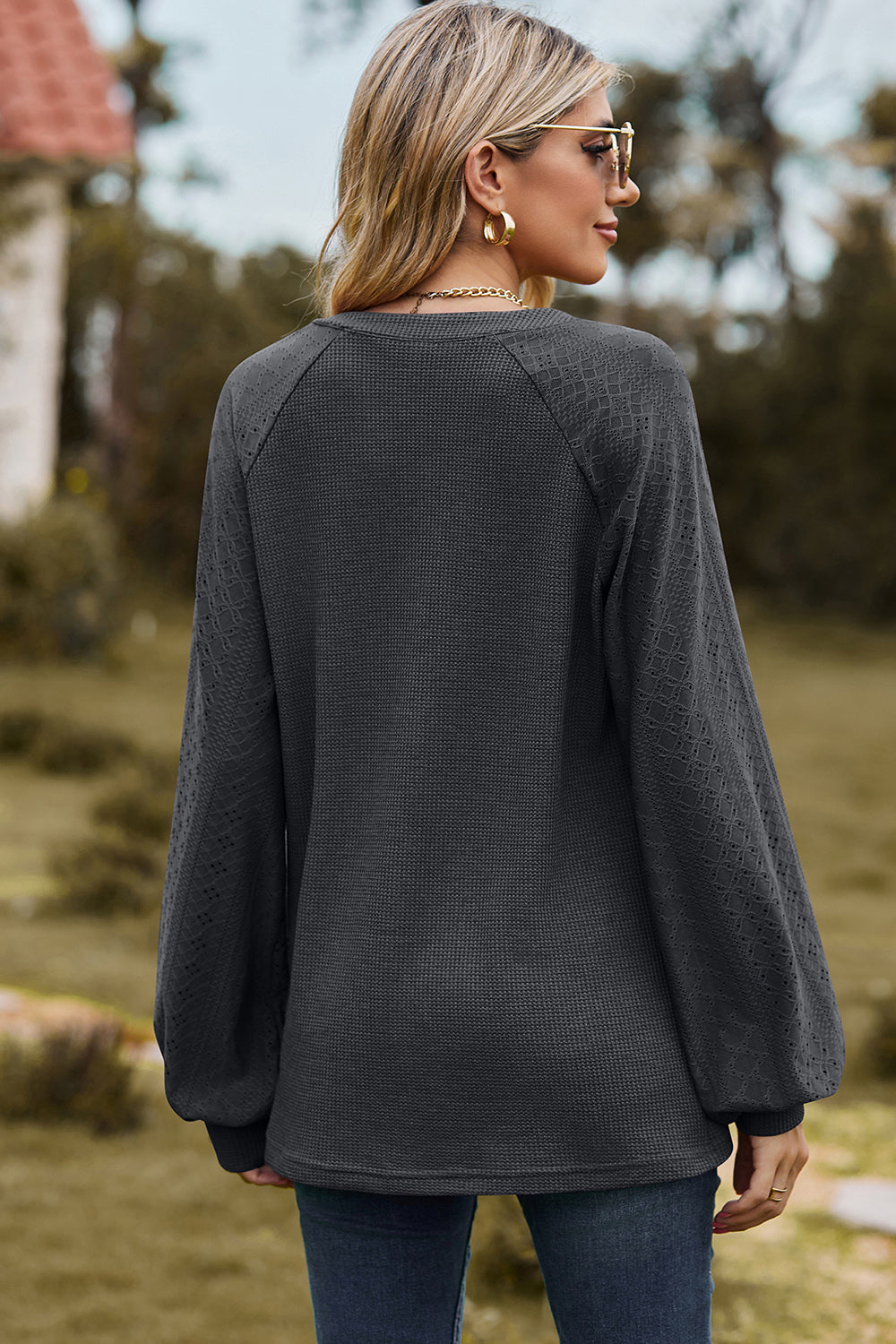 Dark Gray waffle knit raglan top with textured sleeves and V-neck.