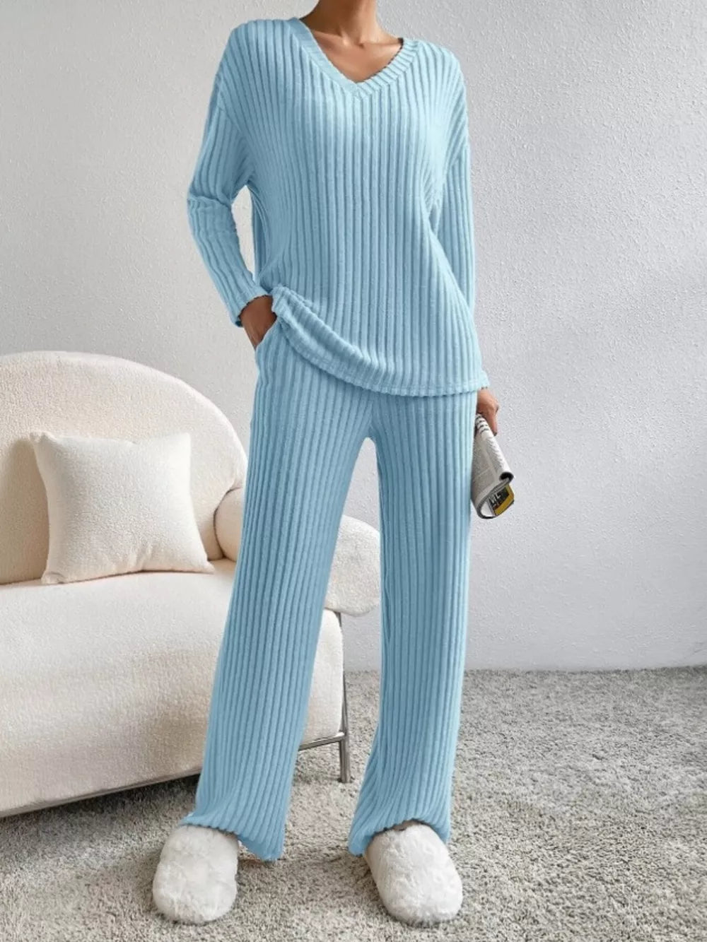 Blue ribbed knit V-neck loungewear set with long sleeves and wide-leg pants.