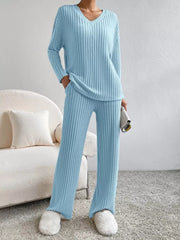 Blue ribbed knit V-neck loungewear set with long sleeves and wide-leg pants.