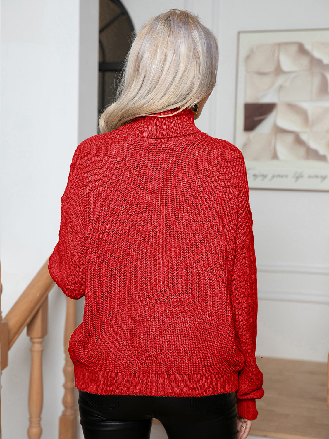 Deep Red acrylic cable knit turtleneck sweater with textured knit and cable detail on sleeves.
