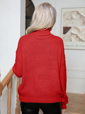 Deep Red acrylic cable knit turtleneck sweater with textured knit and cable detail on sleeves.