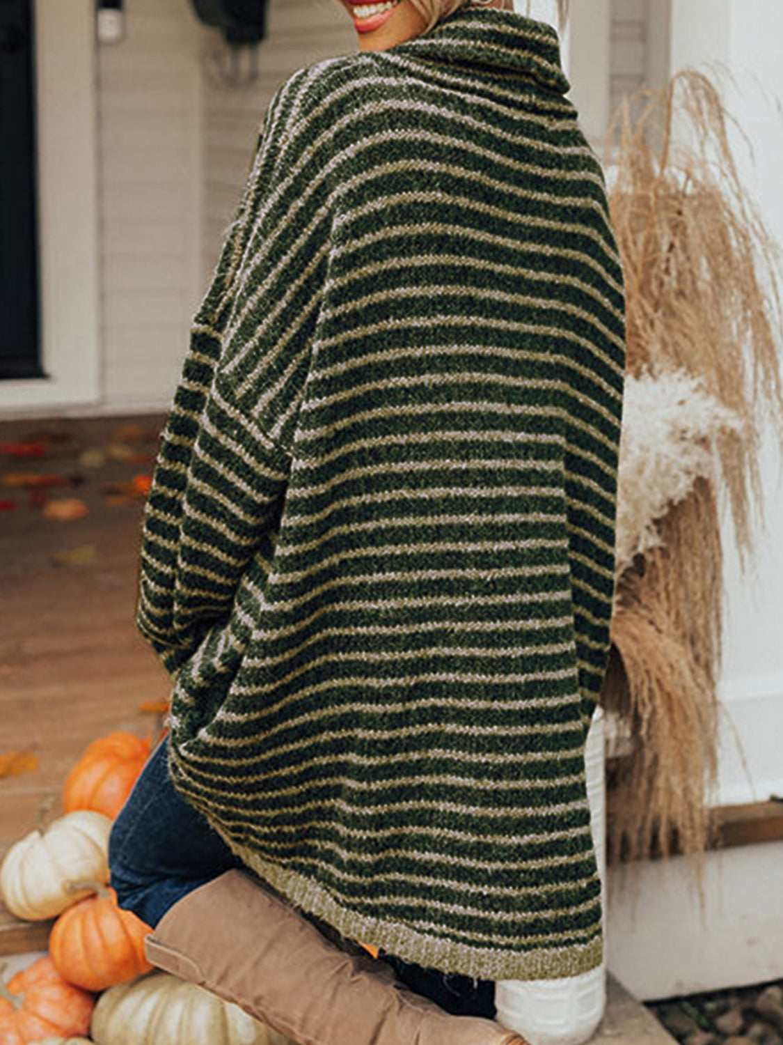 Dark green striped oversized turtleneck sweater with slouch pockets.
