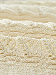Ribbed knit maxi dress in pastel yellow with decorative button details.