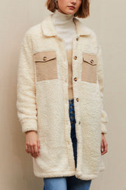 Beige sherpa coat with corduroy patch pockets and button front.