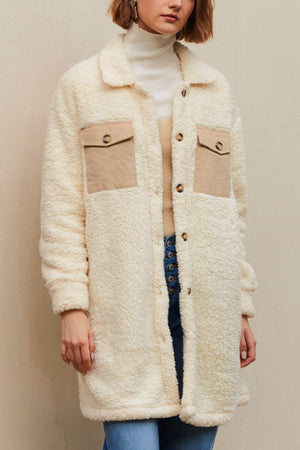 Beige sherpa coat with corduroy patch pockets and button front.