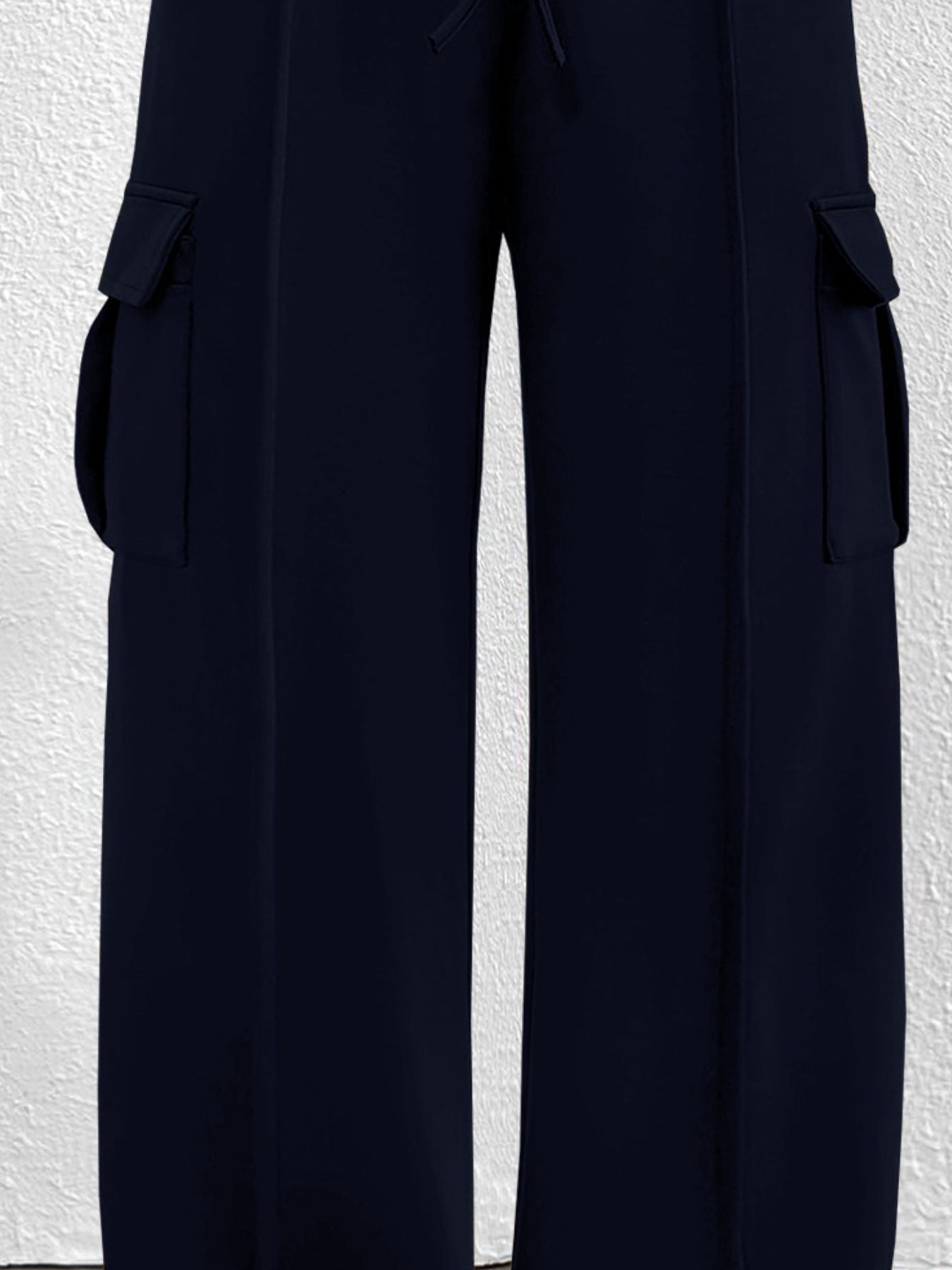 Navy high waist cargo sweatpants with drawstring and flap pockets.