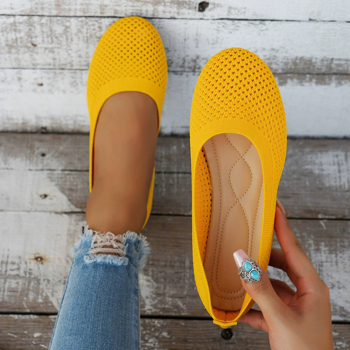 Yellow breathable knit ballet flats with perforated detail and cushioned insole.