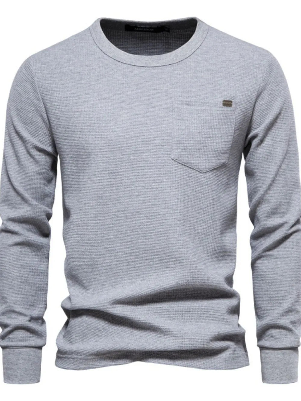 Gray textured thermal long sleeve tee with chest pocket and minimalist detail.