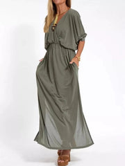 Army green V-neck maxi dress with dolman sleeves, elastic waist, pockets, and side slits.