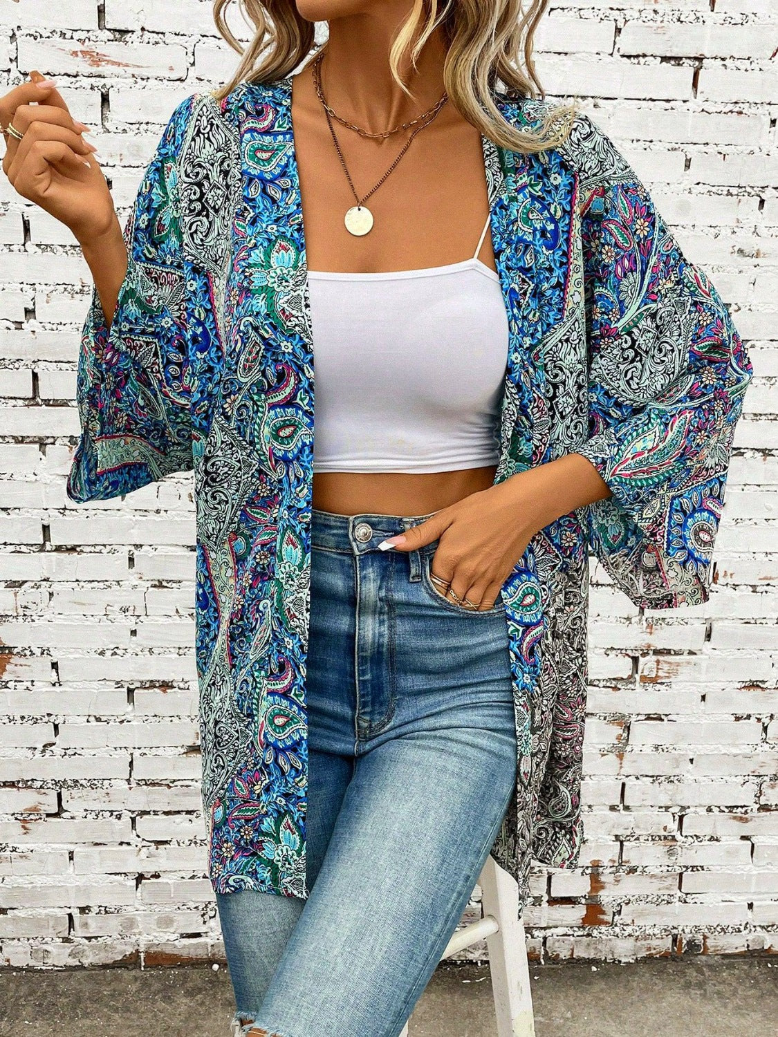 Teal paisley print kimono sleeve duster with open front and wide sleeves.