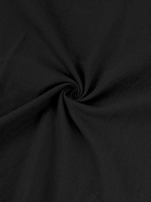 Black cotton button-down shirt with a textured fabric detail.