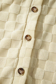 Textured cream checkered romper with button front detail