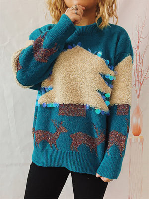 Sky blue knit sweater with sequin-trimmed Christmas tree and reindeer pattern.