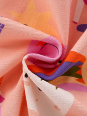 Toddler cotton dress with whimsical unicorn and star print in pink and multicolor.