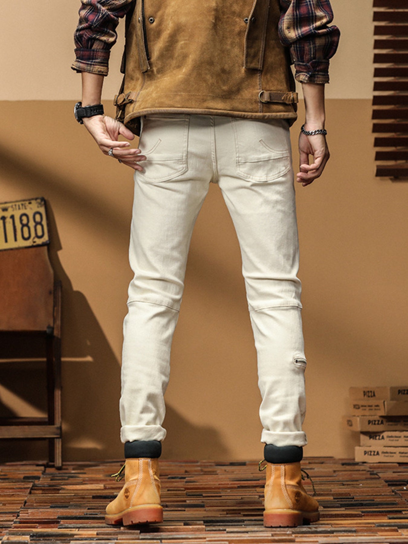 Men's cream cotton denim jeans, slim-fit, with zippered ankle detail.