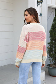 Horizontal stripe waffle knit pullover sweater with crew neck and long sleeves in apricot and white.