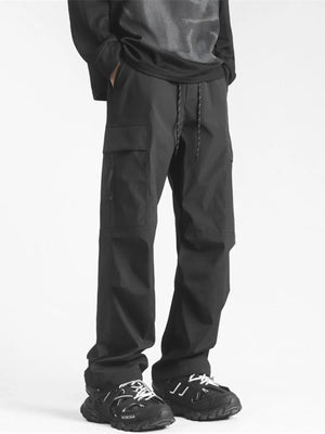 Black loose fit cargo pants with drawstring waist and multiple pockets.